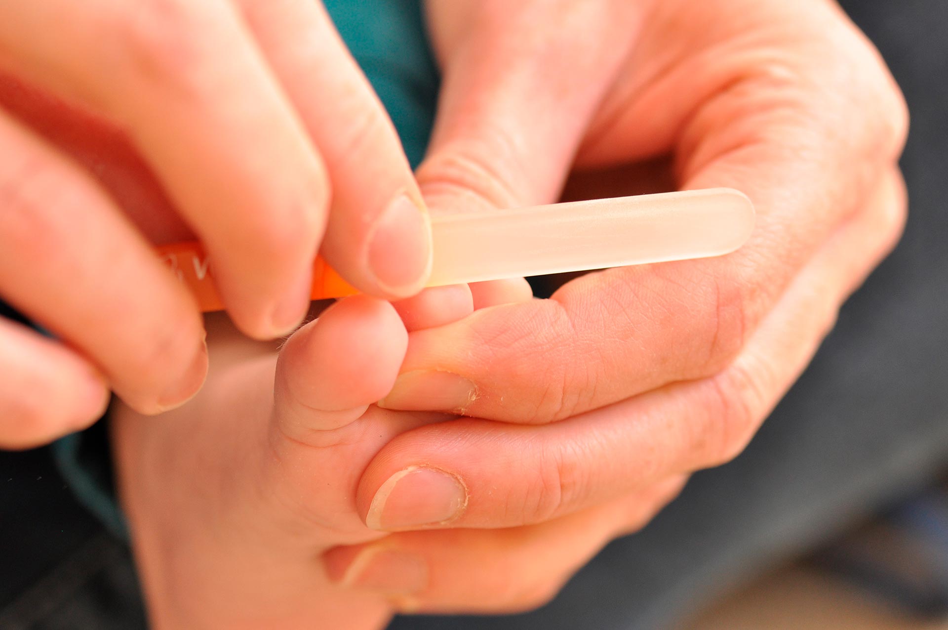 Third slide - baby having toe nails filed
